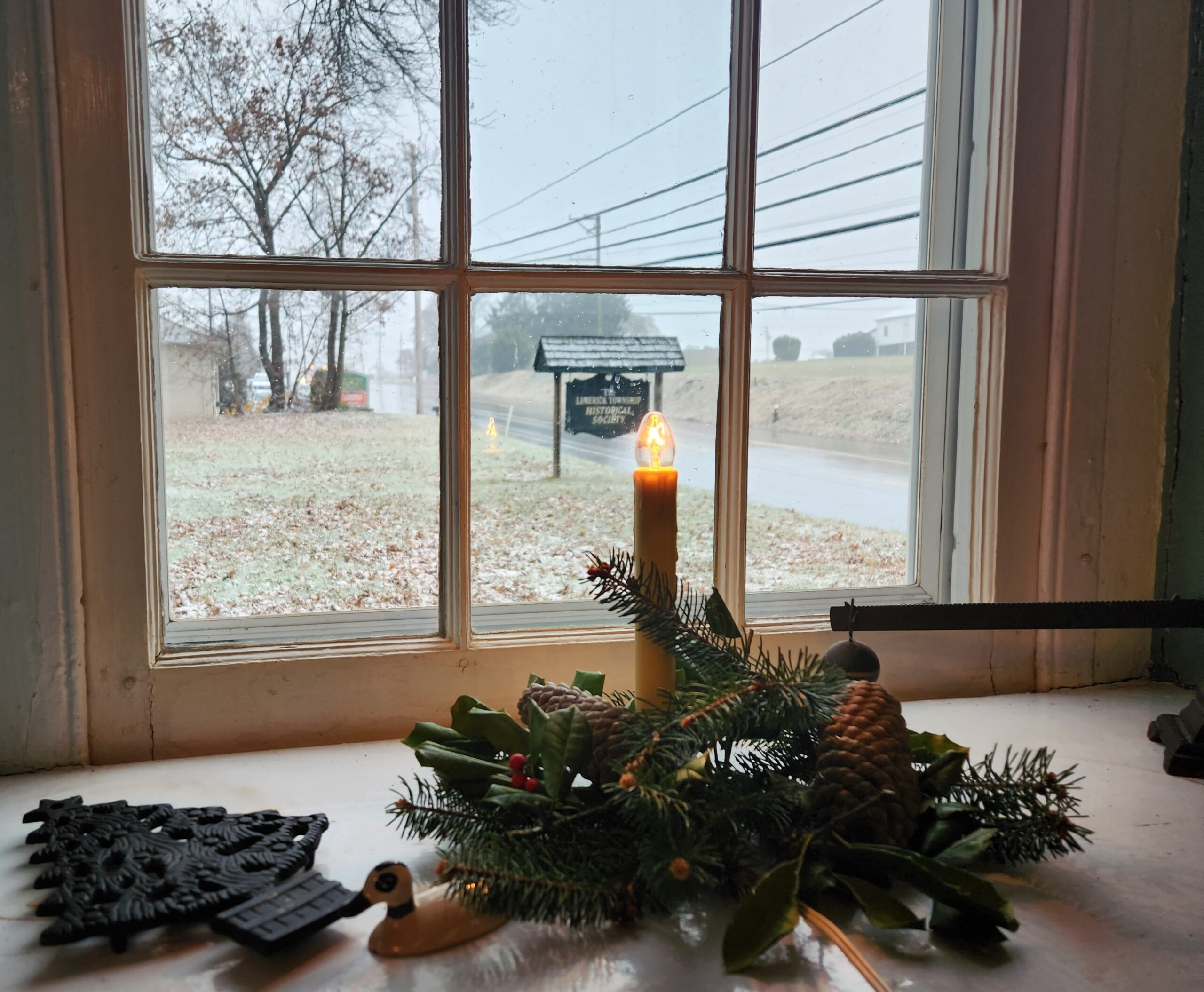 View of holiday decorations and Limerick Township Historical Society sign in the background